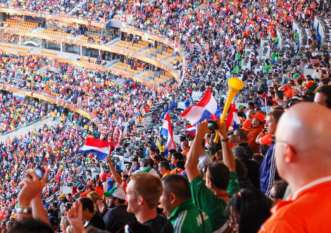 Dutch and Danish fans cheer during the Netherlands vs. Denmark World Cup soccer match at Soccer City Stadium in Johannesburg, South Africa, on June 14, 2010