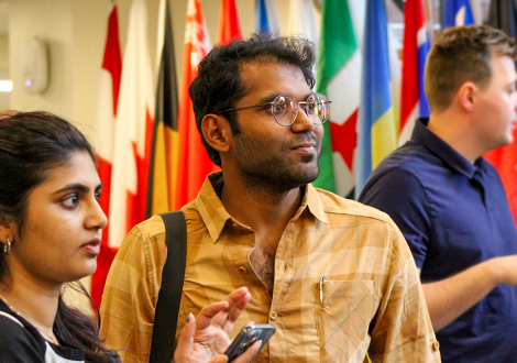 Siddhartha Warwade looks off camera in the Hall of Flags. 
