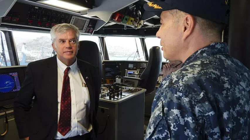 U.S. Ambassador to Cabo Verde Donald L. Heflin, left, speaks with Africa Partnership Station Mission Commander Cmdr. Matthew Flemming, right, during a tour of the Military Sealift Command's joint high-speed vessel USNS Spearhead (JHSV 1) in Mindelo, Cabo Verde, May 8, 2015. 