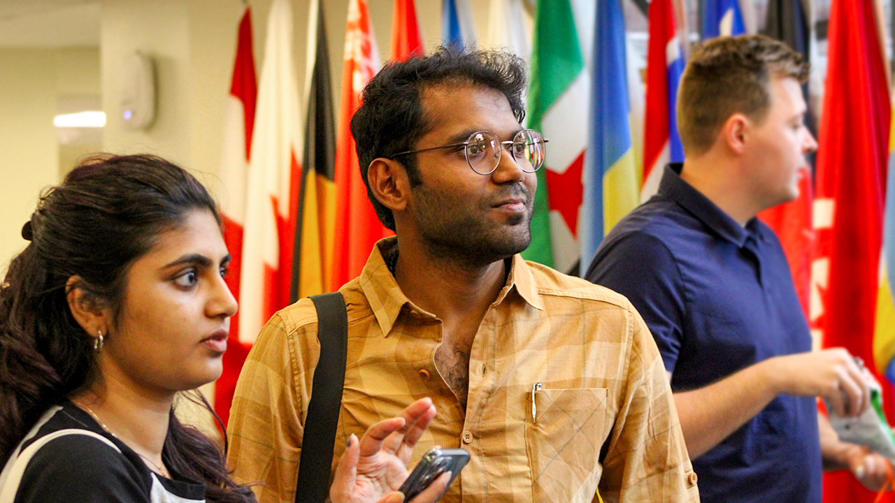Siddhartha Warwade looks off camera in the Hall of Flags. 