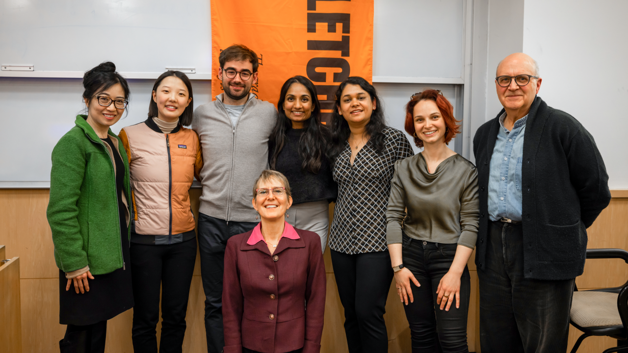 Quyen Tran stands with a Fletcher student impact investing team.