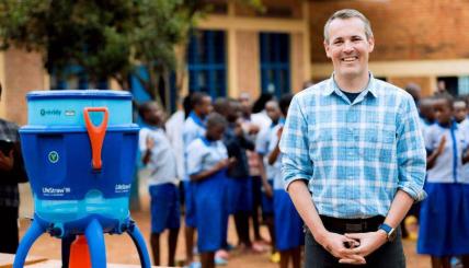 man beside water filter