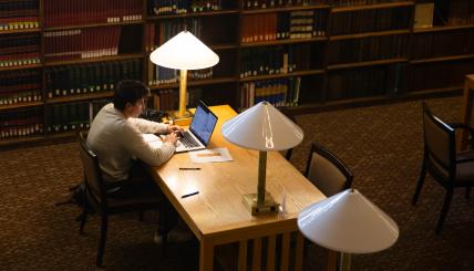 student in library