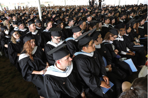 Fletcher School graduates wearing black caps and gowns