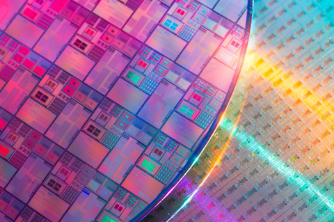 A large round piece of silicon with computer chips etched into it. A Tufts professor explains the history of the semiconductor industry and why it is so critical and politically sensitive