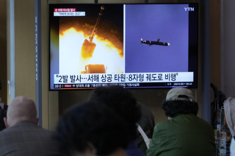 People look at a public TV that has images of a missile launching. The world needs to take Kim Jong Un and his nuclear threats seriously, says a Tufts expert 