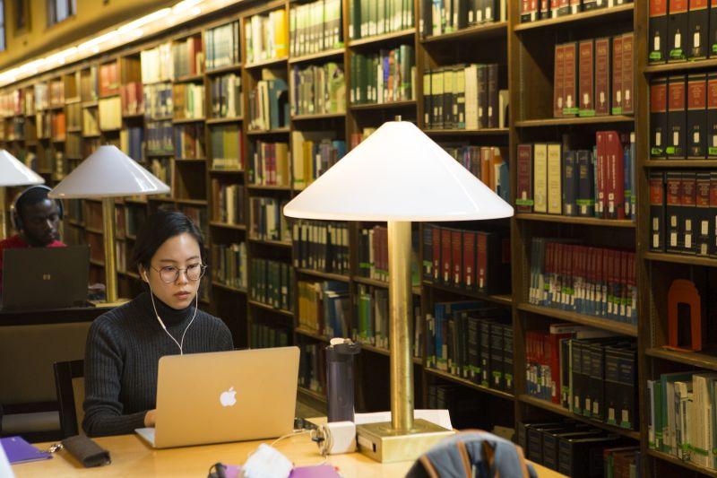 student in library