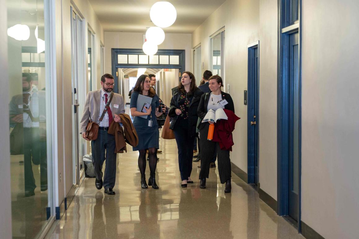 A diverse group of students walking in the hallway