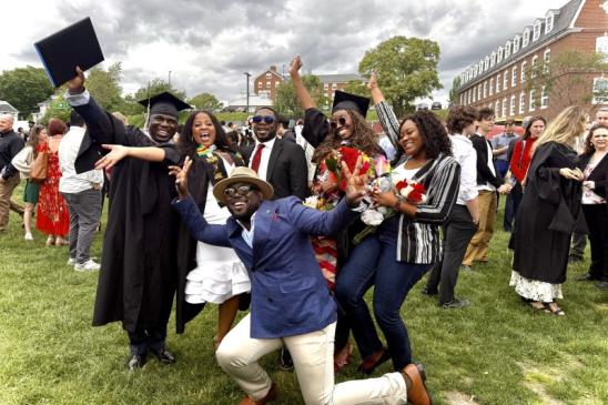A group poses in celebration during Fletcher's Commencement.