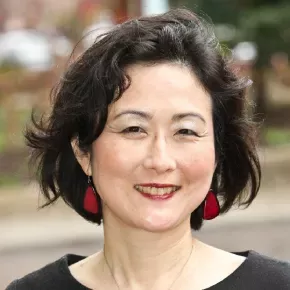 A headshot of Katharine Moon in front of a blurry outdoor background