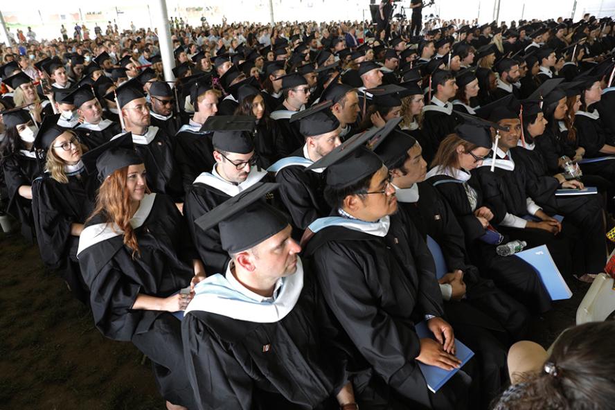 Fletcher School graduates wearing black caps and gowns