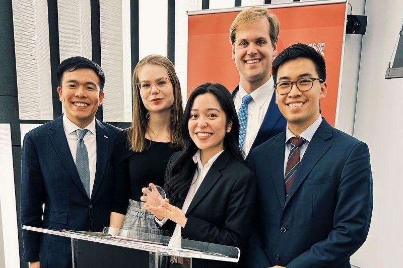 The Fletcher Frontiers pose for a picture, holding their award.