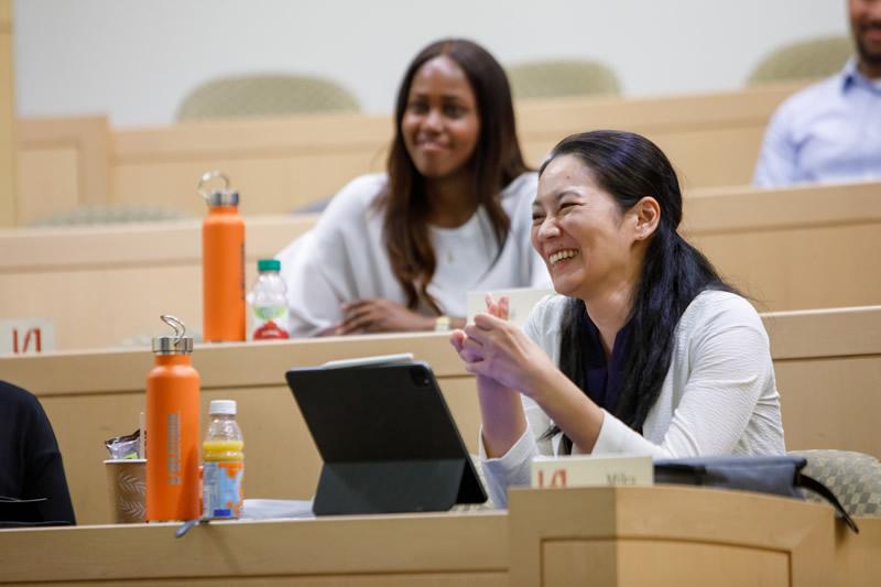 woman in class smiling