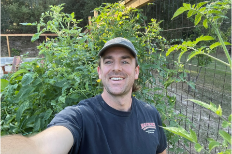 Kit Barron poses in a selfie in his garden