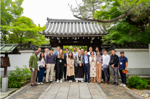 The Yamauchi Japan Initiative cohort poses for a group photo outside of a temple in Japan.