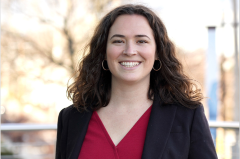 Bethany Tietjen smiles in front of a blurred, outdoor background. 